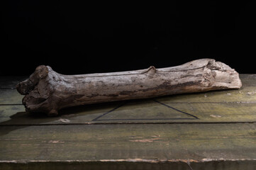A piece of an old branch. Old dry thread. A piece of wood on a box.