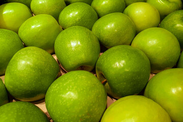 green apples on the market in selective focus