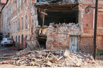 An old vintage ruined residential building as a result of a disaster