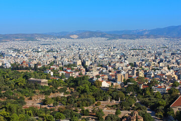 Fototapeta na wymiar View of ancient temple of Hephaestus in Agora and city of Athens in Greece