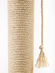 Scratching post for cats on a white background. Close-up.