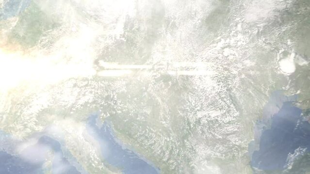 Earth zoom in from outer space to city. Zooming on Vengria, Budapesht. The animation continues by zoom out through clouds and atmosphere into space. View of the Earth at night. Images from NASA