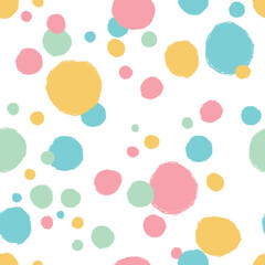 Seamless pattern with polka dots in pastel colors. Dry brush.