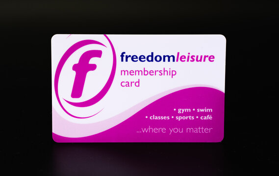 Freedom Leisure membership card for gym, pool and other sports from Stone Leisure Centre. Isolated on black background. United Kingdom, Stafford, December 18, 2021.
