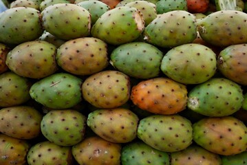 Close up of fresh ripe prickly pears on market stand in Marrakech, Morocco.