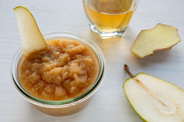 Fruit sauce made of fermented pear with kombucha beverage and ginger. Healthy pear fruit snack dip.
