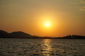 Fototapeta premium Sunset over the Aegean Sea. View from the embankment of the city of Fethiye.