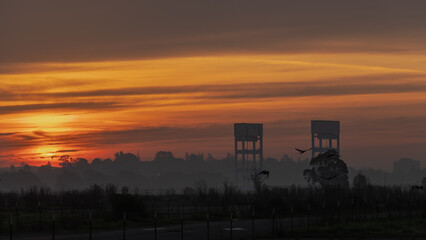 Fototapeta premium Sunrise with a beautiful colorful sky on the bridge towers 
