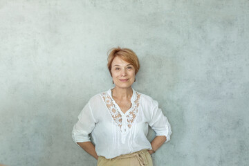 Smiling woman on gray background