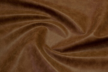 brown artificial leather with waves and folds on PVC base