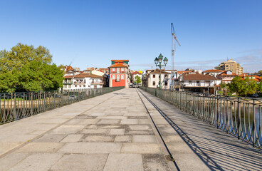 a view of Chaves city from the Roman Bridge (Trajan's bridge) over Tamega river, district of Vila Real, Portugal - April 2019