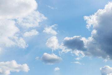 Naklejka na ściany i meble Blue sky background. Blue sky with clouds close up.