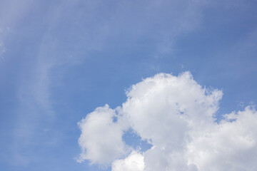 Blue sky background. Blue sky with clouds close up.