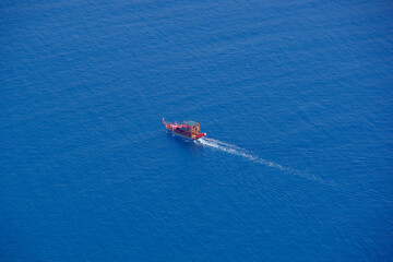 Turkey. Alanya 09.14.21. View from a height of a small boat with passengers on the high seas.