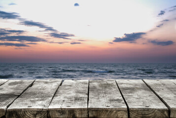 Fototapeta na wymiar Wooden table or bench against the background of the sea and the sky.