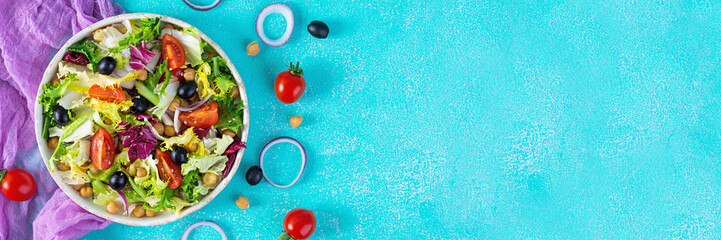 Vegetarian salad with chickpeas, tomatoes, olives and lettuce. Diet salad food
