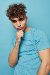 handsome guy in blue t-shirts with a pumped-up body isolated background