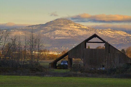 A Barn scene with Roxy Ann Peak in background in Rogue Valley during winter