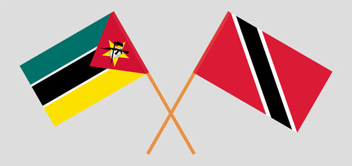 Crossed flags of Mozambique and Trinidad and Tobago. Official colors. Correct proportion