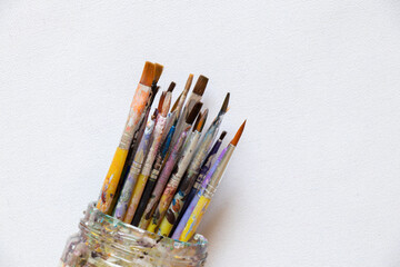 Obraz premium brushes in watercolor paint on an isolated background closeup ,hobby and creativity