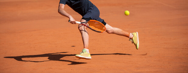 Male tennis player in action on the court on a sunny day. Horizontal sport theme poster, greeting...