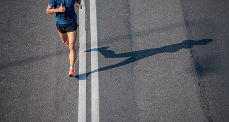 Close up of runner feet. Fitness background, close up of runner feet on the road. Horizontal sport...