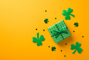Top view photo of st patrick's day decorations green giftbox with polka dot pattern surrounded by...