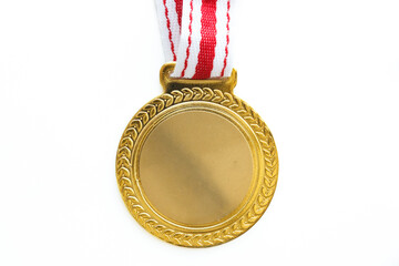 Top view of blank gold medal with red-white ribbon isolated on white background. Olympic games concept.