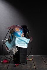 Abstraction with trash can and polluted globe. Pollution of the earth and the planet.