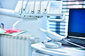 Dental intraoral scanner on table in dentist office. - obrazy, fototapety, plakaty