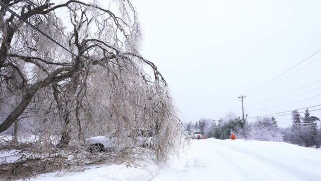 Power Company Trucks Responding To Power Outage During An Ice Storm.