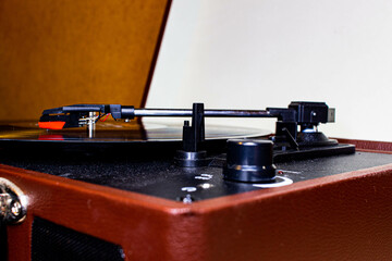 modern turntable with knobs and a vinyl record