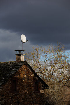 Old house with satelite antenna on the roof