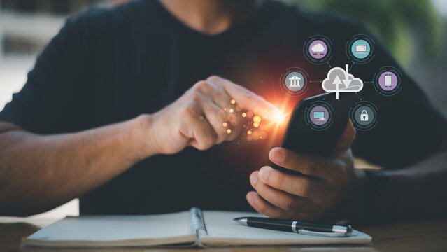 Cloud computing and technology icons touched by hand. Cloud technology collects lifestyle and confidential information such as shopping and internet banking, passwords, financial information.