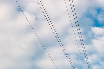 communication wires with a blue sky with clouds in Rio de Janeiro, Brazil.