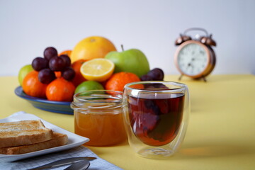 Tea with toasted toast, honey and fruit is a great start to the day