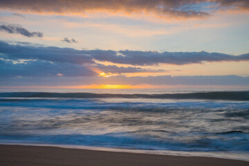 Soft sunrise seascape with clouds