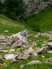 Closeup of rocks on the footpath in between hills, rocky way down in Cave Dale, a dry limestone valley in Castleton the Derbyshire Peak District