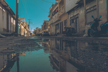 Fototapeta na wymiar Town reflected in water on the streets of Trinidad