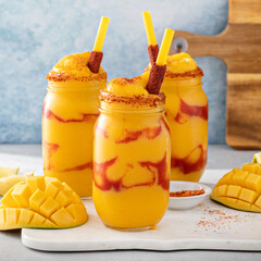 Mangonada mexican mango smoothie with chamoy sauce and lime seasoning