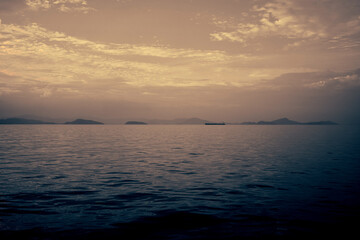 A merchant ship is sailing in the dark and terrifying sea.