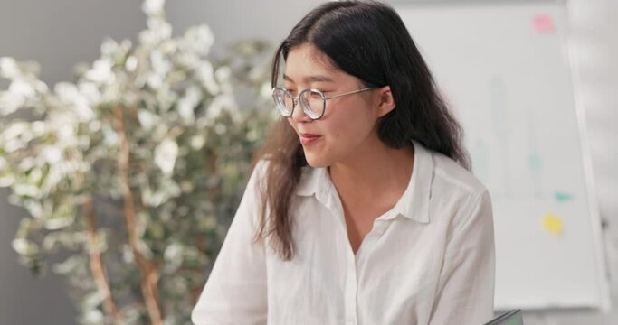 Businesswoman, team leader leads a meeting of corporate employees, they talk about work, the girl explains the rules of the new project, distributes tasks, laughs, jokes
