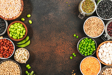Legumes, beans and sprouts. Dried, raw and fresh, top view. Red beans, lentils, mung beans, chickpeas, soybeans, edamame, green peas, Healthy diet food, vegan protein, micronutrients fiber sources