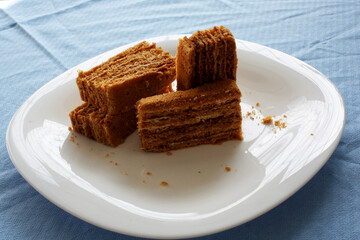 pieces of honey cake on a white plate
