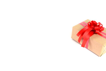 Brown craft gift box with red ribbon bow isolated on white background.