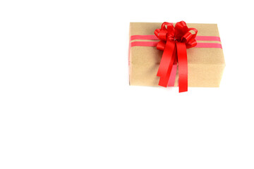 Brown craft gift box with red ribbon bow isolated on white background.