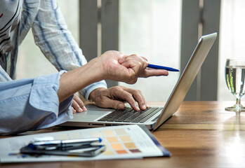 two people working together with notebook computer