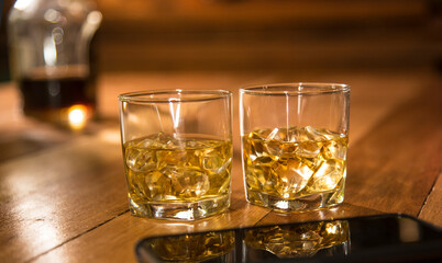 two glasses of whiskey on the rock cocktail