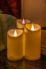 Christmas diwali decoration with fairy lights, candles, books,  Cozy home and holiday concept spa and relax