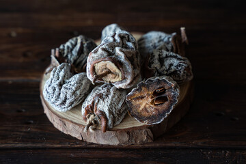 Dried persimmon on a wooden background. Healthy diet